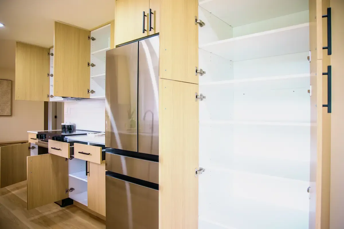 Light wood cabinets with open shelving and high-end hardware